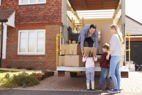 Moving van and packed boxes on a residential street in Haringey