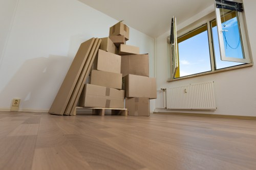 Local removals van outside a North London property with moving supplies