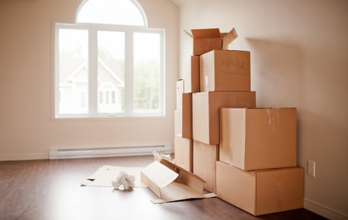 Packed business equipment ready for commercial move in Haringey