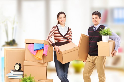Professional movers transporting items on a Haringey street