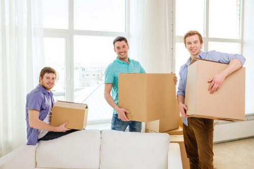 Trained staff handling furniture safely during a van move