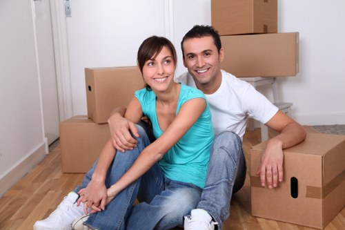 Professional movers loading furniture into a van in Haringey