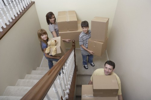 Packed moving boxes and furniture for a home relocation in Haringey